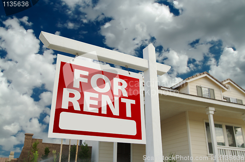 Image of For Rent Real Estate Sign in Front of House