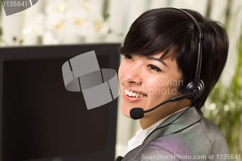 Image of Attractive Young Woman Smiles Wearing Headset