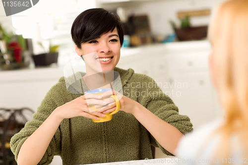 Image of Multi-ethnic Young Attractive Woman Socializing with Friend