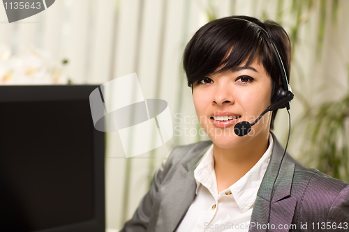 Image of Attractive Young Woman Smiles Wearing Headset