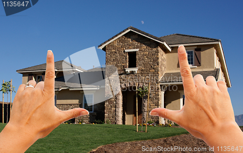 Image of Female Hands Framing Beautiful House