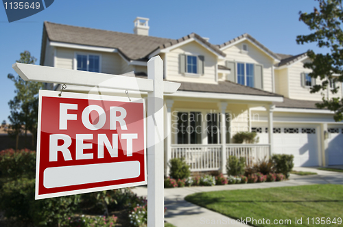 Image of For Rent Real Estate Sign in Front of House