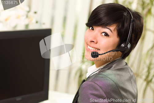 Image of Attractive Young Woman Smiles Wearing Headset