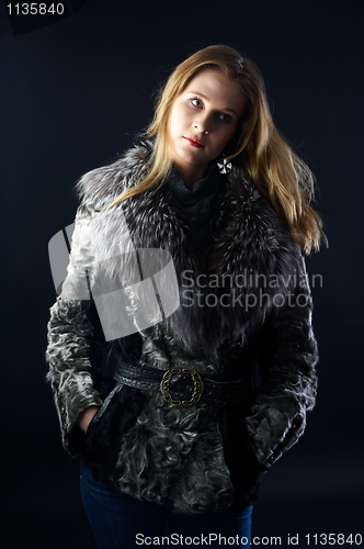 Image of Attractive woman in fur coat