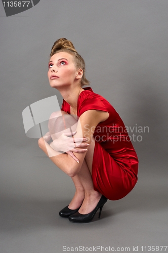 Image of Sexy slim woman in red dress