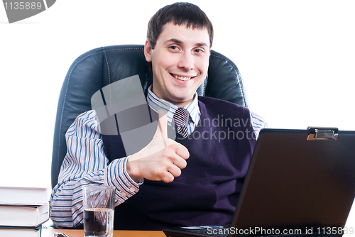 Image of Portrait of a young businessman with laptop