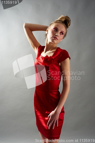 Image of Sexy slim woman in red dress