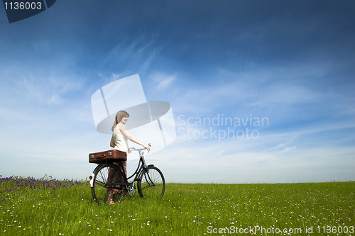 Image of Girl with a bicycle