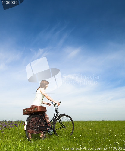 Image of Girl with a bicycle