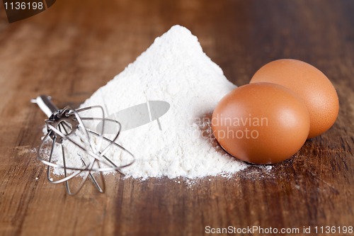 Image of eggs, flour and whisk