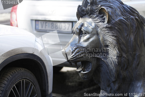 Image of Lion Among Cars