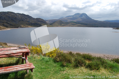 Image of Picnic table at a beautiful lake