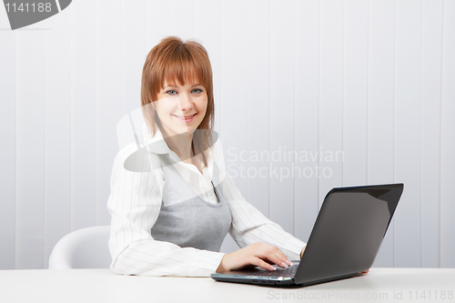 Image of  happy girl with a laptop