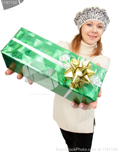 Image of girl in winter hat gives gift box
