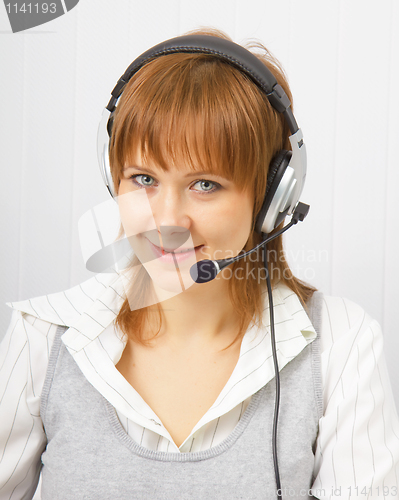 Image of attractive girl in headphones with microphone