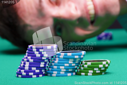 Image of Chips on the background of a man's face