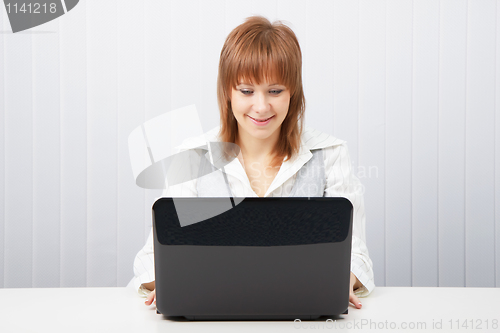 Image of  happy girl with a laptop