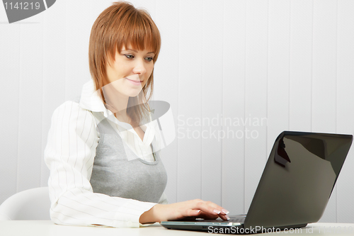 Image of happy girl with a laptop