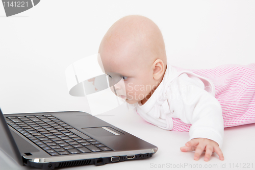 Image of infant with a computer