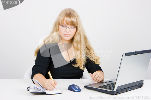 Image of blonde girl with a laptop