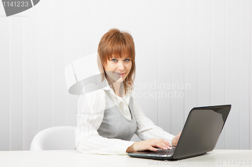 Image of attractive girl with a computer