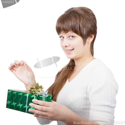 Image of attractive young woman with a gift on a white background