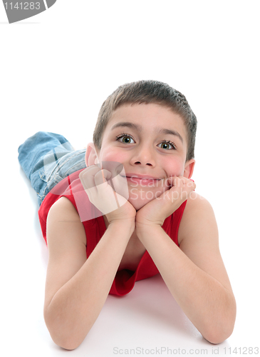 Image of Cute smiling boy relaxing looking ahead