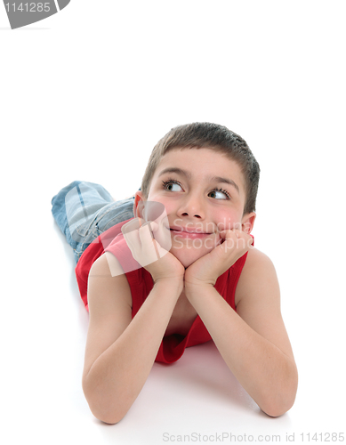 Image of Cute boy head in hands looking sideways