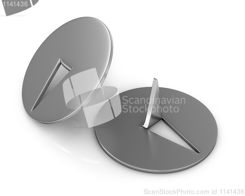Image of Two metal thumbtacks closeup
