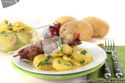 Image of Shashlik skewer with potato salad