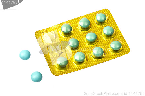 Image of Set of green pills isolated on white 