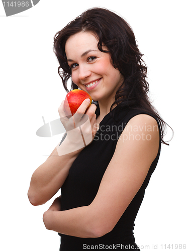 Image of Young attractive woman with red apple