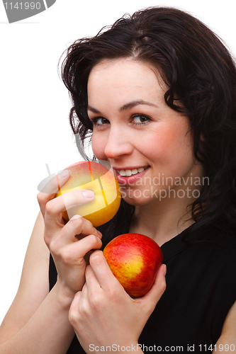 Image of Young attractive woman with two red apple