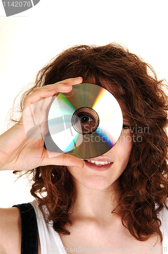 Image of Girl looking through a disk.