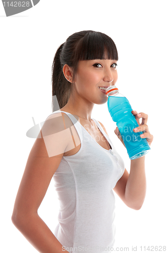 Image of Attractive girl drinking sports drink after exercise