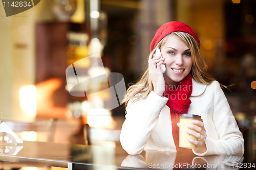 Image of Woman talking on the phone