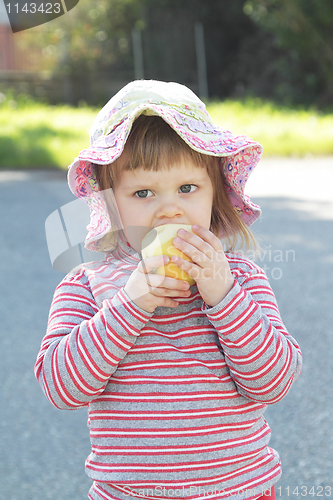 Image of Little girl with apple