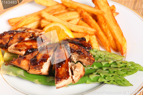 Image of Chicken breasts with asparagus and sauce