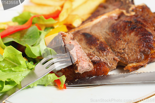 Image of Eating T-bone steak