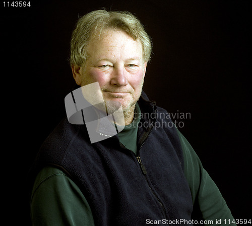 Image of handsome middle age senior posing for studio portrait 