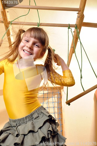 Image of child at her home sports equipment