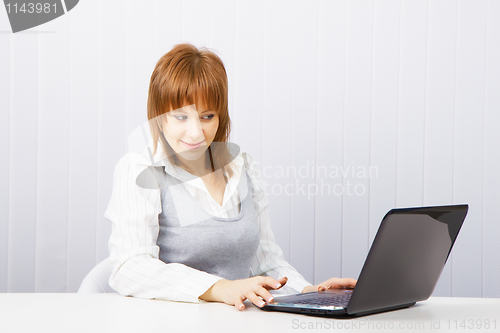 Image of girl with surprise stares at the monitor laptop