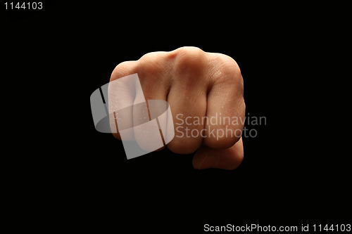 Image of A man´s fist isolated on black background