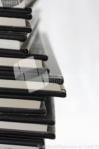 Image of Stack of black equal books