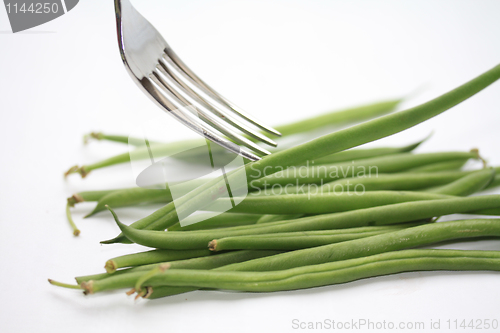 Image of haricots verts - common green beans on a fork