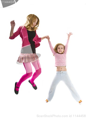 Image of Happy sisters jumping together