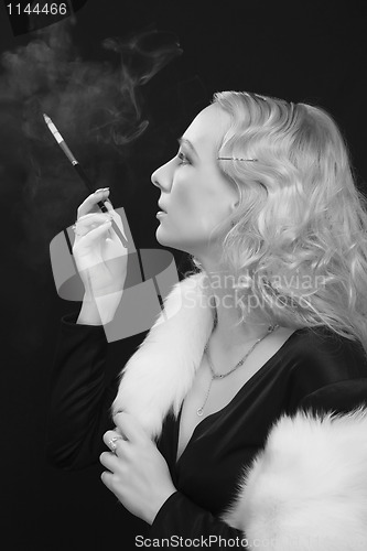 Image of retro style shot - lady smoke cigarette