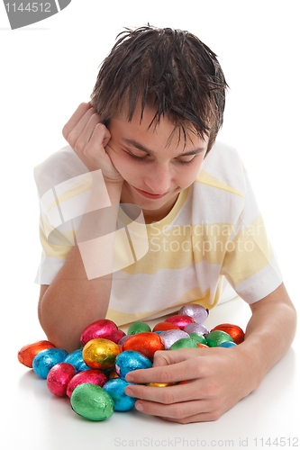 Image of Boy with lots of easter eggs