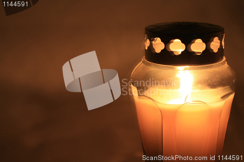 Image of burning votive light
