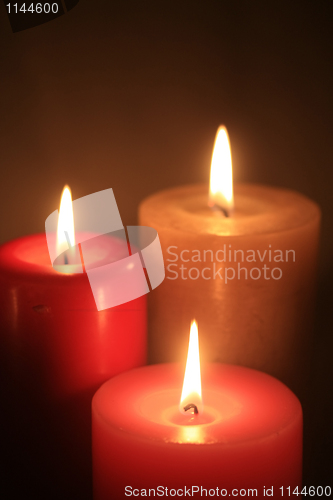 Image of group of three burning candles